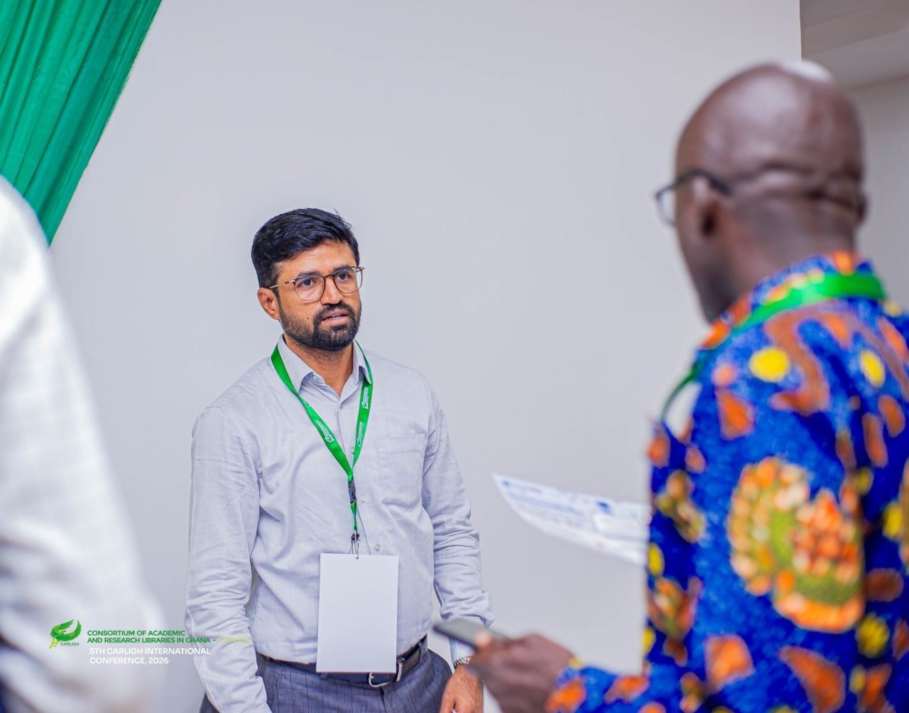 DrillBit team member in conversation with a delegate at CARLIGH 2026